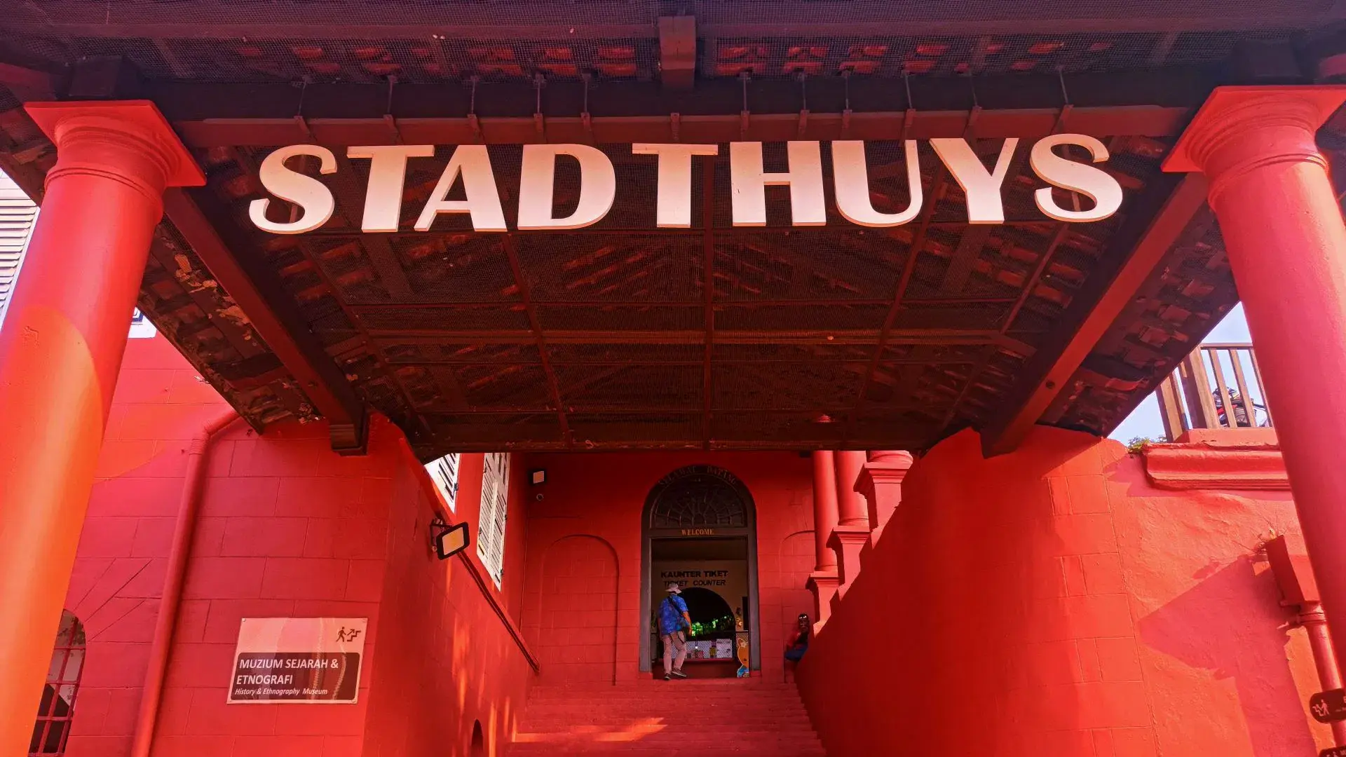 The Stadthuys entrance portico in Melaka, lettered STADTHUYS above the steps